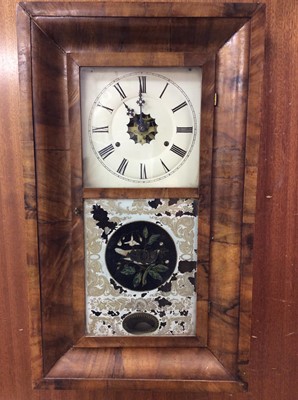 Lot 463 - American WML Gilbert & Co reverse painted glass wall clock in walnut case