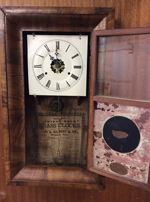 Lot 463 - American WML Gilbert & Co reverse painted glass wall clock in walnut case