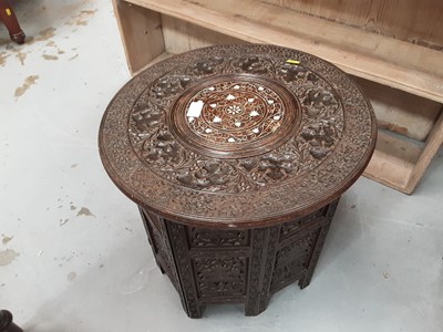 Lot 901 - Two carved Middle Eastern occasional tables