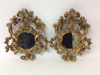 Lot 1371 - Pair of 19th century Continental gilt gesso wall mirrors in ornate carved frames