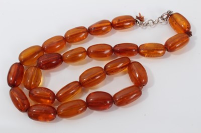 Lot 496 - Clear Amber necklace and pendant