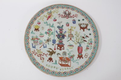 Lot 39 - 19th century Chinese famille rose porcelain dish, decorated with precious objects, ruyi pattern border, 34cm diameter