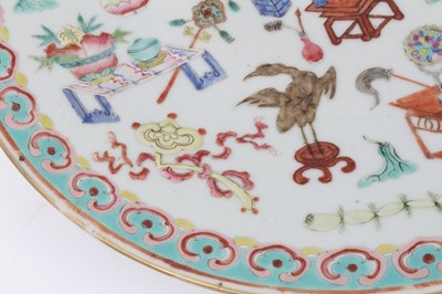 Lot 39 - 19th century Chinese famille rose porcelain dish, decorated with precious objects, ruyi pattern border, 34cm diameter
