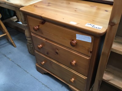 Lot 873 - Pine narrow three drawer chest and four drawer pine chest, two pine stools and loom chair