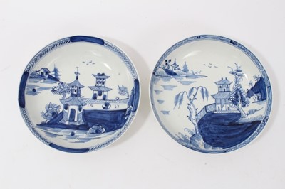 Lot 52 - Two similar Lowestoft blue and white saucers, c.1790, painted with Oriental pagoda patterns, ex. Kitty Brumpton collection