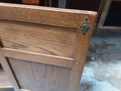 Lot 910 - Old Charm carved oak court cupboard with leaded glazed doors above, three drawers and three doors below with linen fold decoration