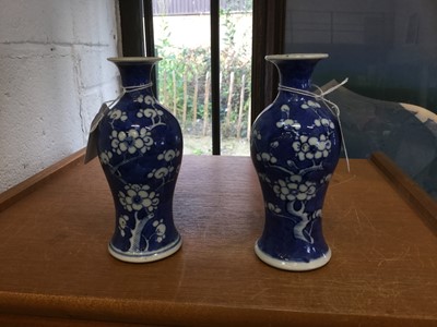 Lot 147 - Pair of late 19th Century Chinese porcelain vases with prunus decoration on crushed ice ground, with character marks to bases