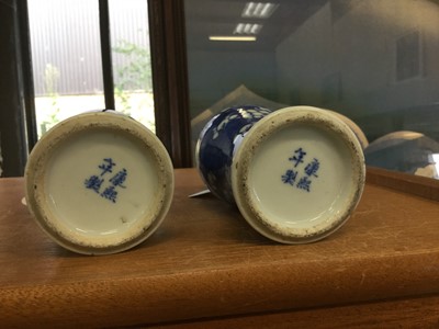 Lot 147 - Pair of late 19th Century Chinese porcelain vases with prunus decoration on crushed ice ground, with character marks to bases