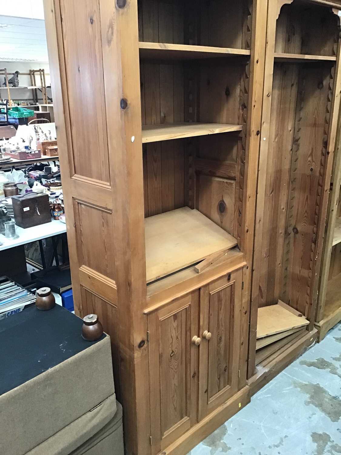 Lot 1016 - Narrow pine bookcase with cupboard below