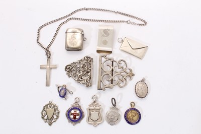 Lot 305 - Selection of miscellaneous silver bijouterie including vesta, money clip, stamp holder, locket, various badges and other items (Various dates and makers) all at approximately 6ozs. (qty)