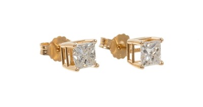 Lot 478 - Pair of diamond princess cut single stone earrings