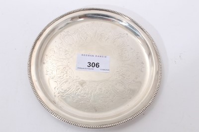 Lot 306 - Victorian silver card tray of circular form, with foliate engraved decoration and bead border (London 1857) Henry Wilkinson & Co. Together with a pair of Edwardian silver salts of compressed balust...