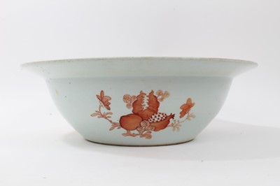 Lot 122 - Large antique Chinese porcelain bowl, circa 1900, decorated with bats, fish and foliate patterns on a dark blue ground, 41cm diameter