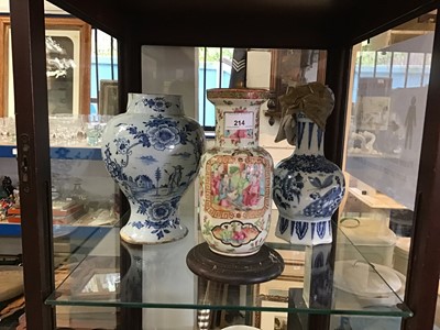 Lot 214 - 19th Century Chinese Famille Rose vase together with two antique Delft vases (3)