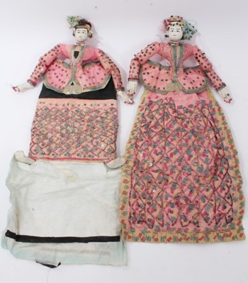 Lot 807 - Unusual pair of early 20th century Eastern fabric dolls, applied with sequins and gilt threads, 48cm long