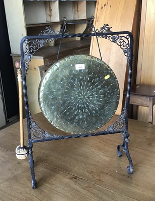 Lot 104 - Old brass gong in wrought iron stand