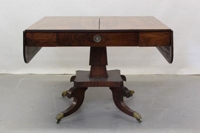 Lot 1265 - George III inlaid mahogany sofa table with frieze drawer, two flaps, square taper column on shaped platform with four scroll legs on brass castors, opening to 146 x 73 cm, 72cm high