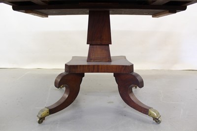 Lot 1265 - George III inlaid mahogany sofa table with frieze drawer, two flaps, square taper column on shaped platform with four scroll legs on brass castors, opening to 146 x 73 cm, 72cm high