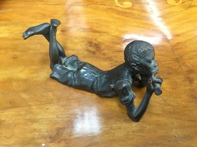 Lot 284 - Bronze figure of a reclining boy after Bergman