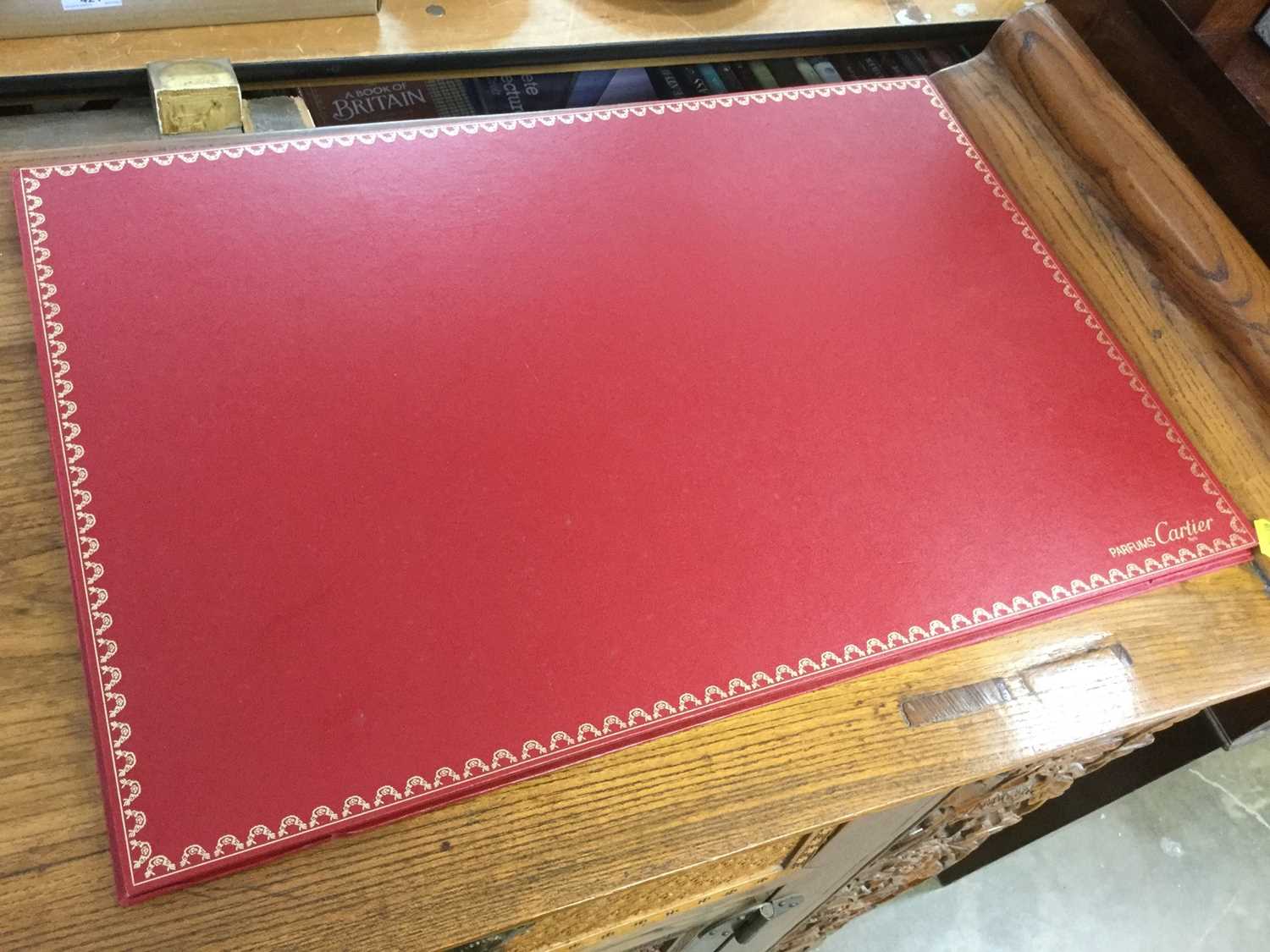 Lot 316 - Cartier Parfums desk blotter containing a group of unframed works