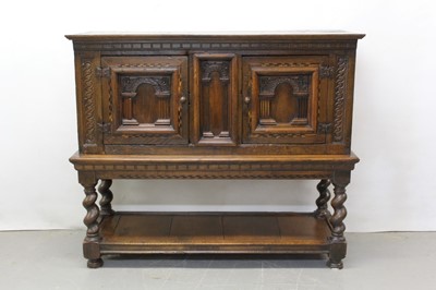 Lot 1290 - 17th century and later oak cupboard on stand with central arched panel flanked by two arched panelled doors on stand with spiral twist supports with undertier on bun feet. 148cm wide, 52cm deep,1...