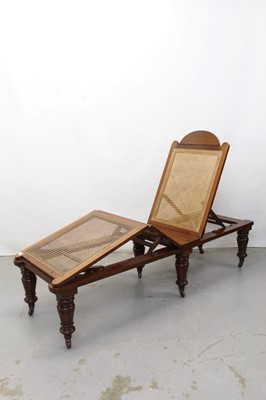 Lot 1291 - Late Victorian officers folding mahogany framed campaign bed with caned base and adjustable back on removable turned legs on brass and ceramic castors.