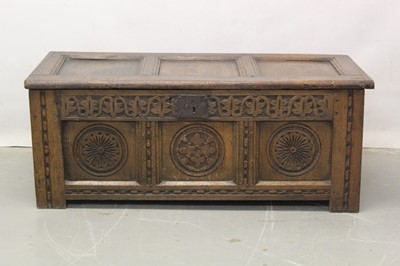 Lot 1292 - Small 17th century carved oak coffer with Regency lining paper to interior 108cm wide, 47cm deep, 44 cm high.