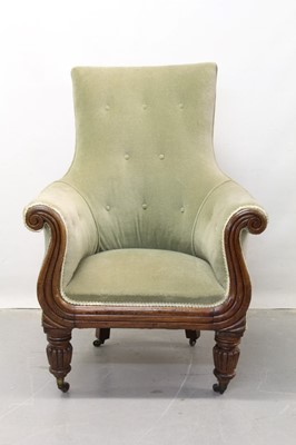 Lot 1293 - Regency mahogany scroll arm easy chair with buttoned green dragon upholstery on turned and fluted legs.