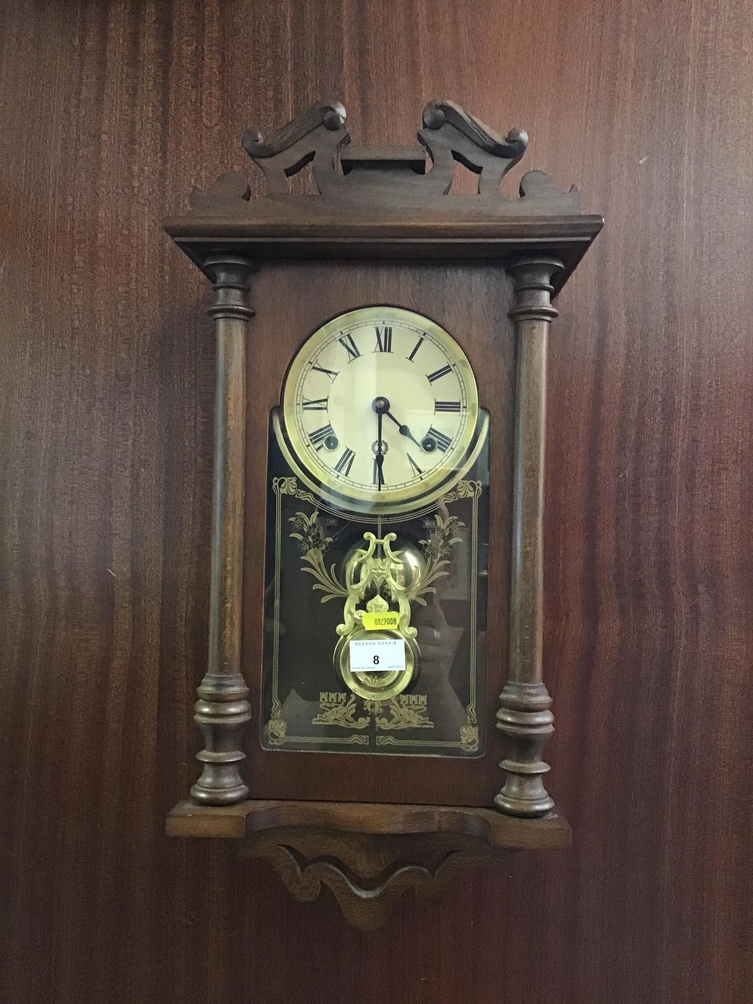 Lot 8 Oak hanging wall clock enclosed by glass frame