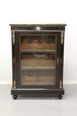 Lot 1299 - Late 19th century French inlaid ebonised pier cabinet with ormolu mounts and inset floral porcelain panel, glazed door enclosing velvet lined shelves, raised on bun feet.77cm wide, 34 cm deep, 109c...