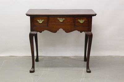 Lot 1302 - 18th century oak lowboy with shaped top, three drawers, shaped apron on cabriole legs with Spanish toes 82 cm wide, 44 cm deep, 72cm high