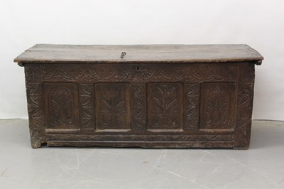 Lot 1300 - Large 17th century carved oak coffer with tulip decoration