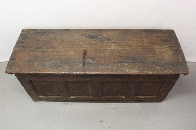 Lot 1300 - Large 17th century carved oak coffer with tulip decoration