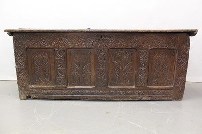 Lot 1300 - Large 17th century carved oak coffer with tulip decoration