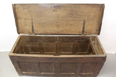 Lot 1300 - Large 17th century carved oak coffer with tulip decoration