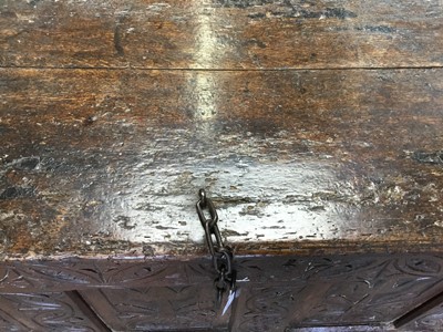 Lot 1300 - Large 17th century carved oak coffer with tulip decoration