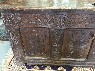 Lot 1300 - Large 17th century carved oak coffer with tulip decoration