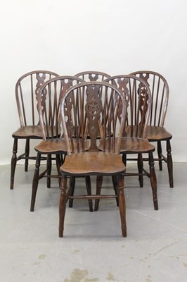 Lot 1303 - Six 19th century elm country Windsor stick back chairs with star motives to splats on turned legs