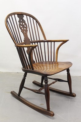 Lot 1308 - 19th century Windsor elm wheelback rocking elbow chair