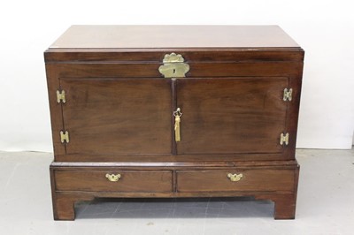 Lot 1310 - Georgian mahogany chest converted to a cupboard with two doors with brass mounts and carrying handles 122cm wide, 60cm deep, 62cm high