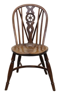 Lot 1275 - Early 19th century yew and elm wheelback Windsor chair with circular seat and crinoline stretcher.