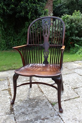 Lot 1315 - George III fruitwood and elm Windsor elbow chair of generous proportions and good patination, with pierced splat and stick back, saddle seat, front cabriole legs and crinoline stretcher.