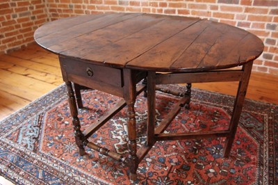 Lot 1317 - Fine and rare late 17th/early 18th century yew gateleg table, the oval top with two frieze drawers, on turned and block understretcher