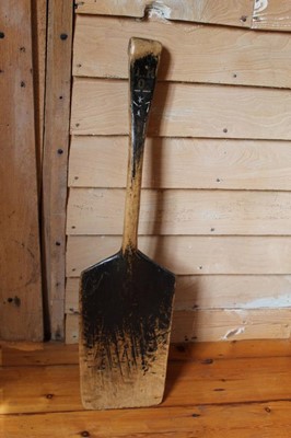 Lot 1323 - Antique carved sycamore malt shovel, 100cm.