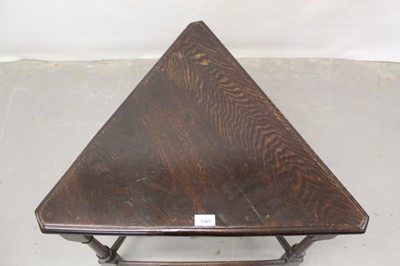 Lot 1365 - Unusual triangular oak table