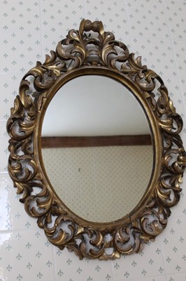 Lot 1342 - 19th century Florentine oval wall mirror, with scrolling pierced acanthus frame, 71cm x 50cm