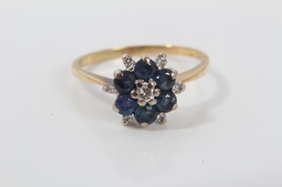 Lot 504 - Sapphire and diamond cluster ring on 18ct gold shank