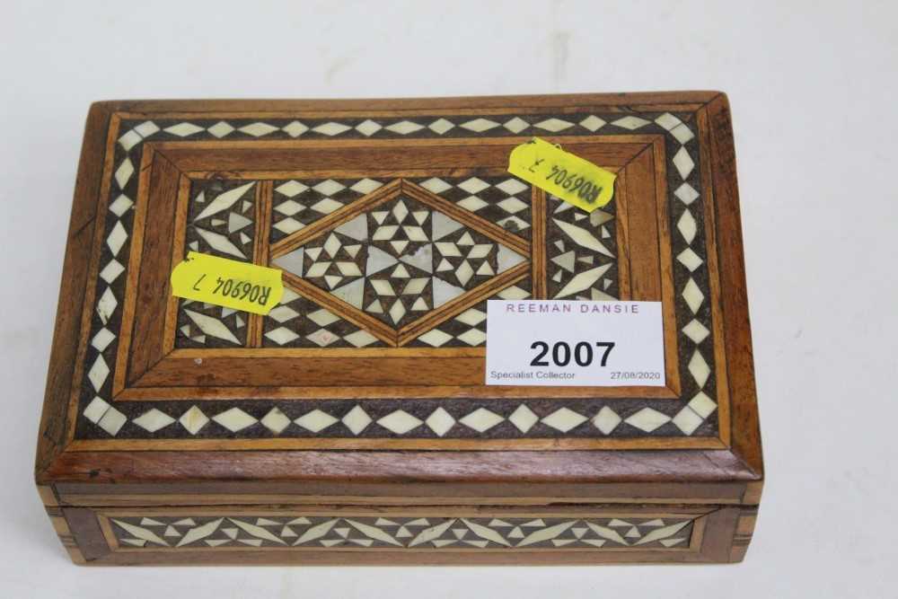 Lot 2007 - Inlaid box containing pins, badges and an Ingersoll stopwatch