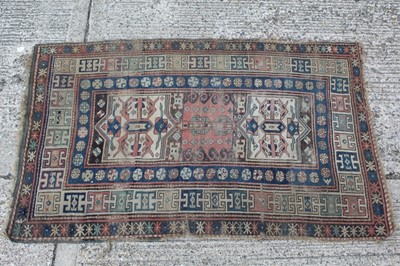 Lot 1401 - Old Persian rug with geometric medallions on red, blue and cream ground 210cm x 127cm