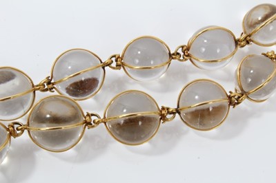 Lot 505 - Antique crystal bead necklace with 23 graduated spherical beads cased in gold wire cages on a gold clasp, 46cm